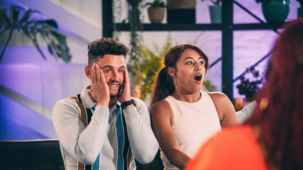 A guy and a girl look very surprised, a still from Married at First Sight